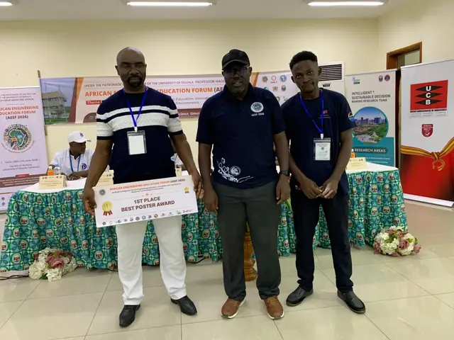 Best Poster Award winners holding their prize